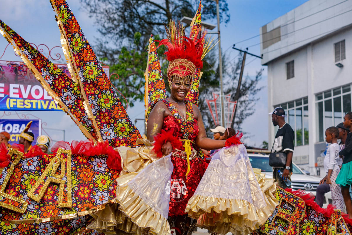 Colorful carnival performers in traditional Nigerian costumes dancing at Calabar Carnival celebration