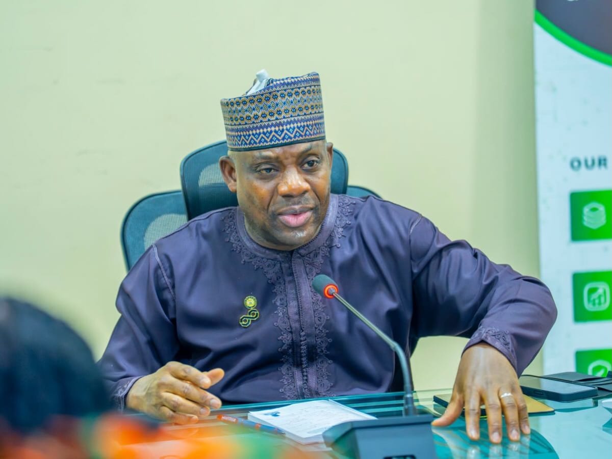 Nigerian students learning digital skills on computers in a community education center