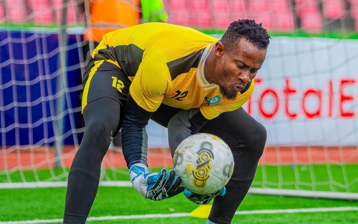 Nigerian goalkeeper Amas Obasogie in Super Eagles uniform celebrating his cleared name