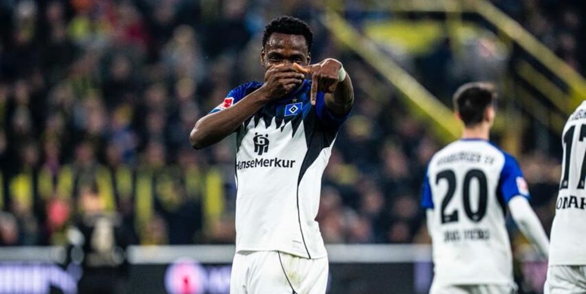 Nigerian striker Philip Otele celebrating in Hamburg SV jersey during Bundesliga match