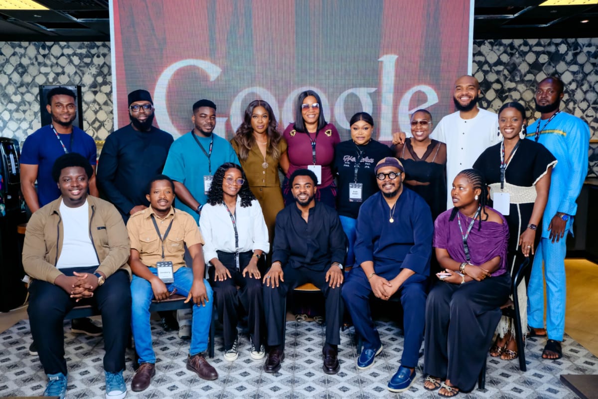 Nigerian filmmaker working with laptop during YouTube AI training workshop in Lagos