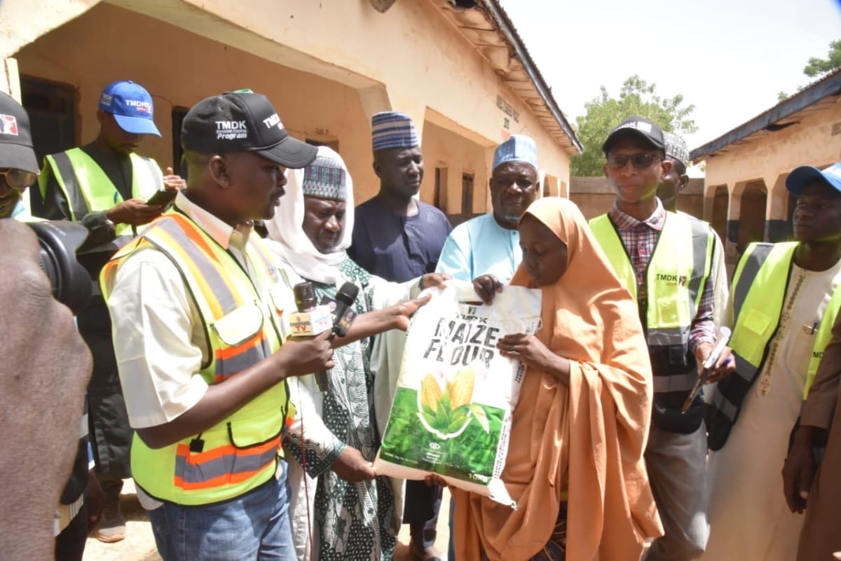 Community members receiving bags of rice and maize flour during Ramadan food distribution in Zamfara State Nigeria