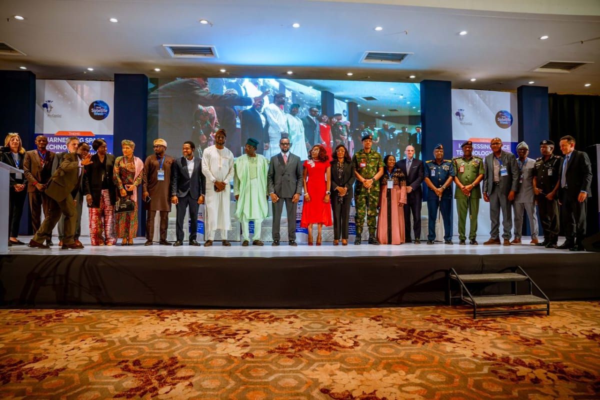 Nigerian satellite engineers monitoring space technology systems at communications facility in Abuja