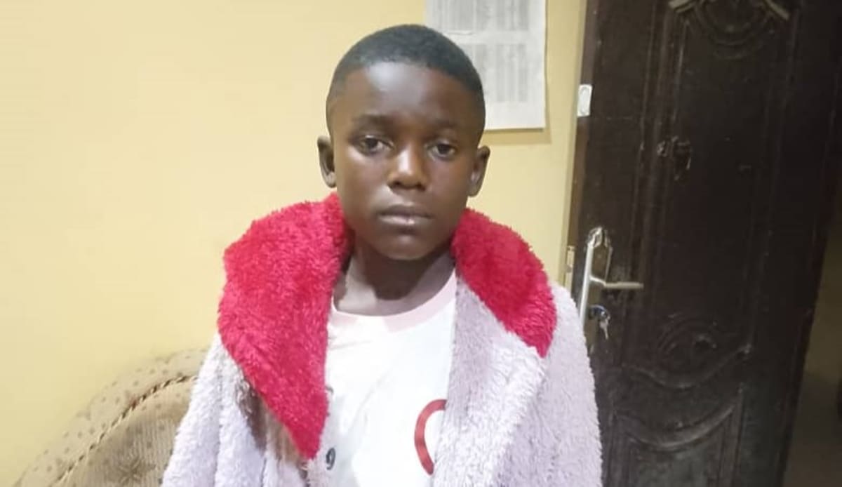 Police officer helping reunite families in Kano State, Nigeria community cooperation effort