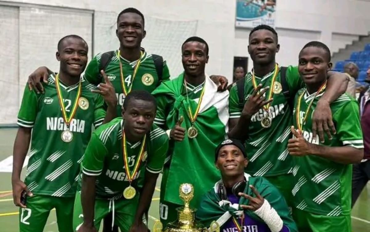 Nigerian youth handball team celebrates with trophy after winning regional championship in Togo