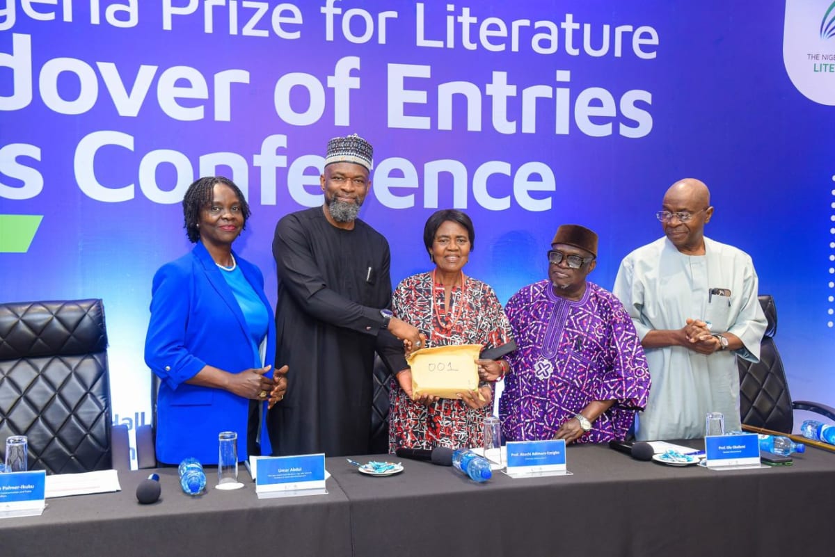 Stack of poetry manuscript submissions on table during Nigeria Prize for Literature ceremony in Lagos