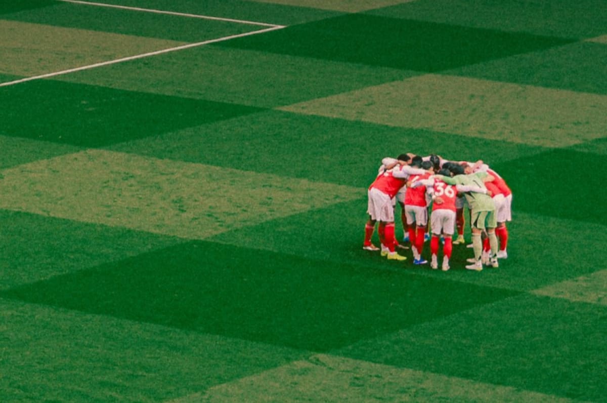 Bournemouth players celebrating their historic 2-1 away victory against Arsenal at Emirates Stadium