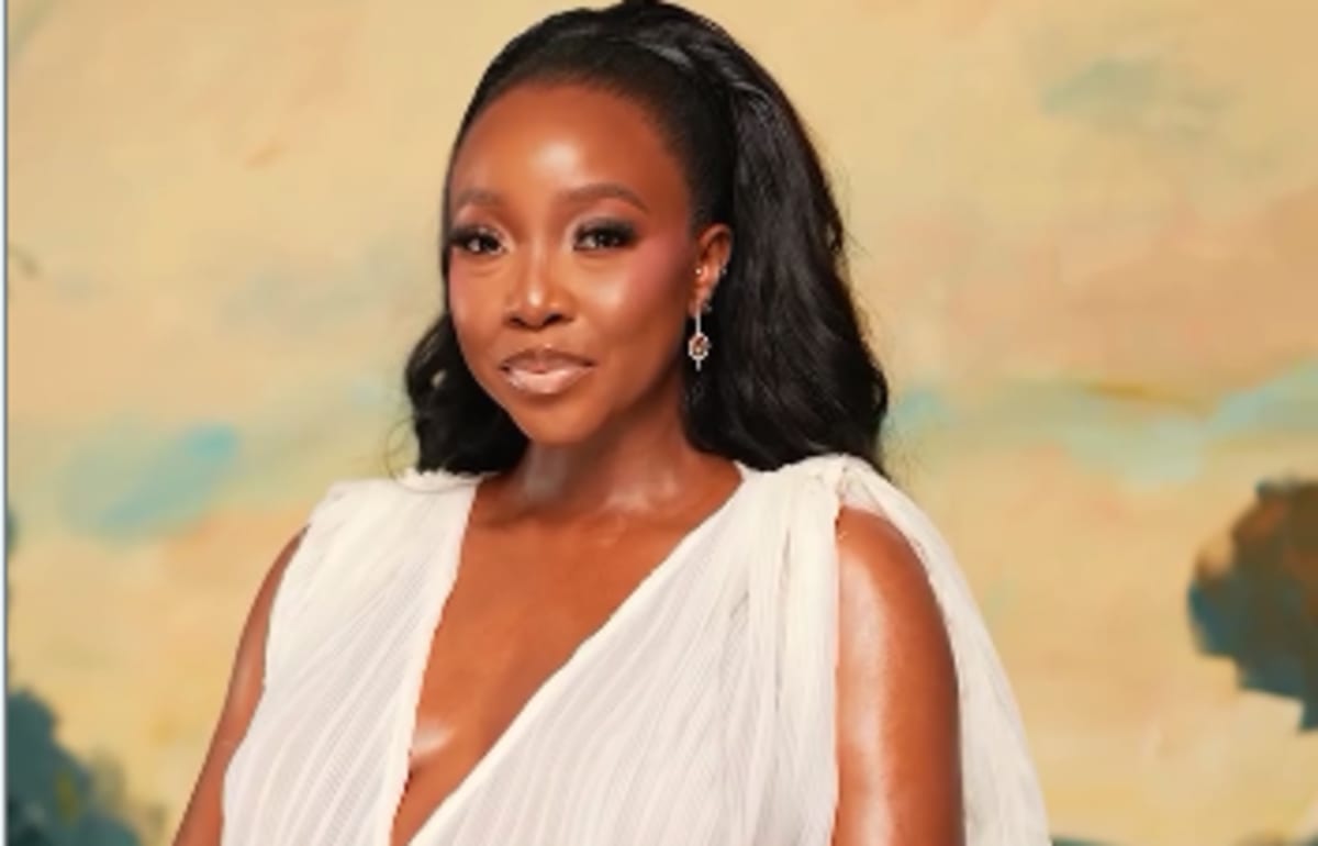 Nigerian actress Ini Dima-Okojie smiling while celebrating her pregnancy announcement after years battling fibroids