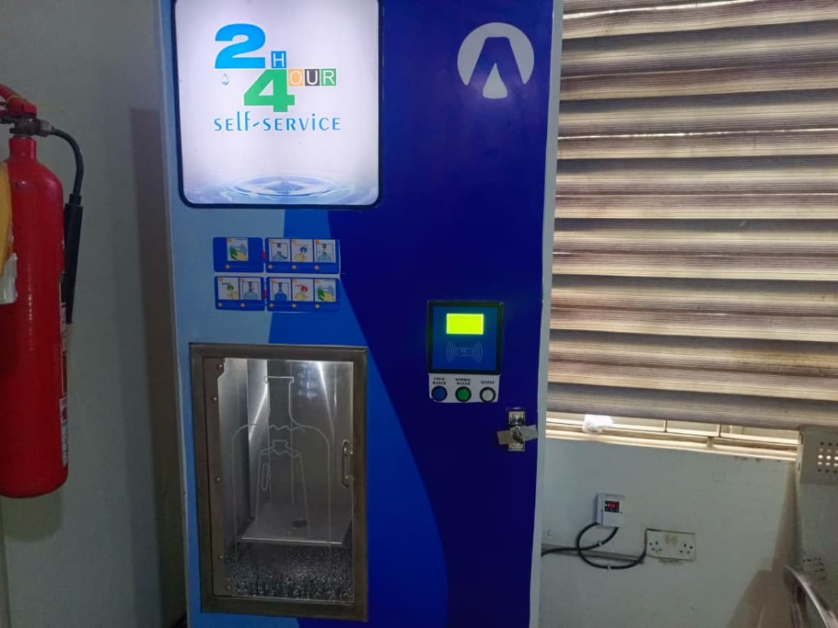 Modern water filtration machine dispensing clean drinking water at Lagos hospital facility