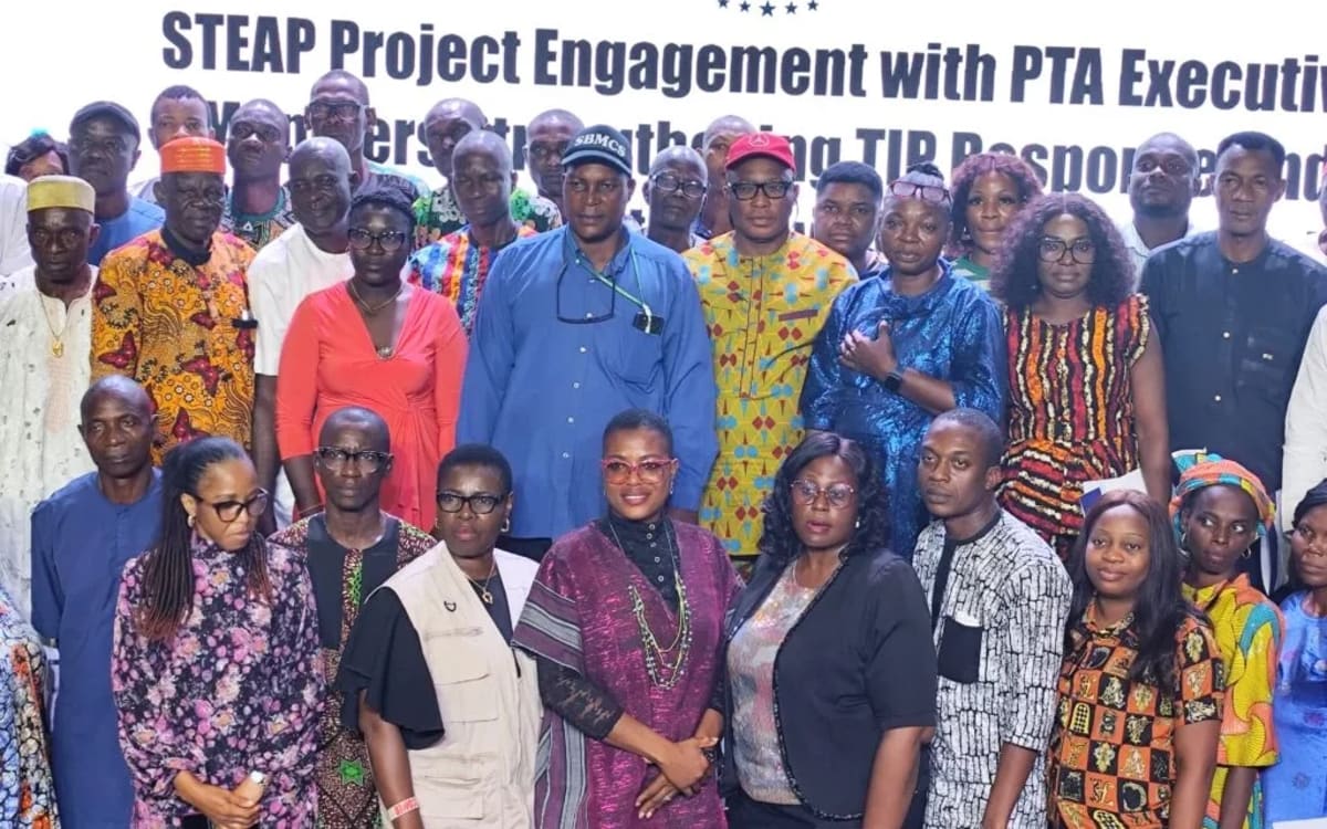 Nigerian parents and teachers gathered in classroom learning about protecting children from human traffickers