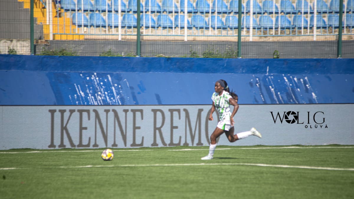Toni Payne celebrates in Nigeria's green jersey after scoring against Senegal