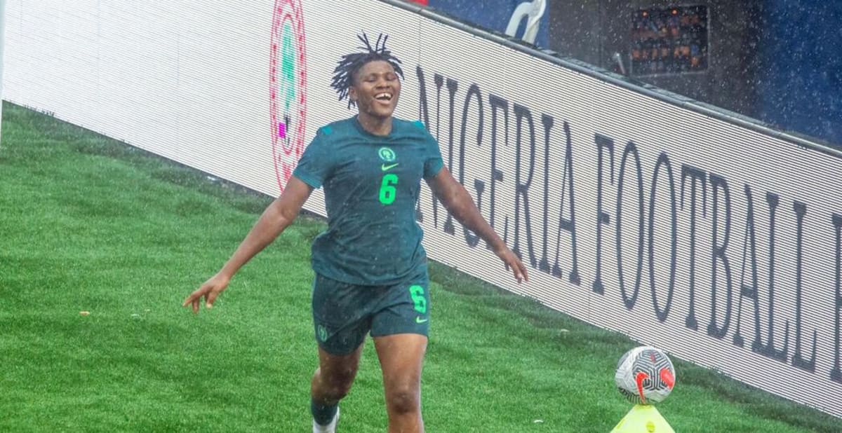 Nigerian Super Falcons players celebrating together after scoring goal against Senegal at home stadium