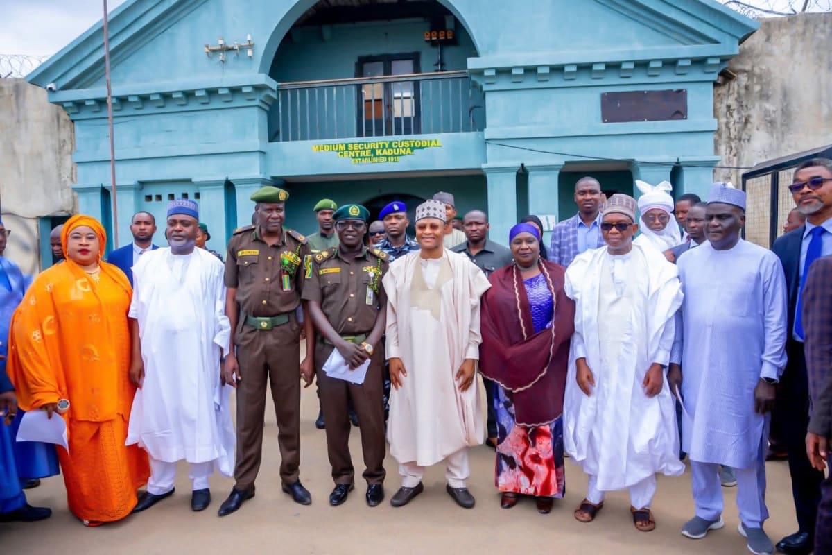 Nigerian government officials distributing cash support to recently pardoned inmates at Kaduna correctional facility