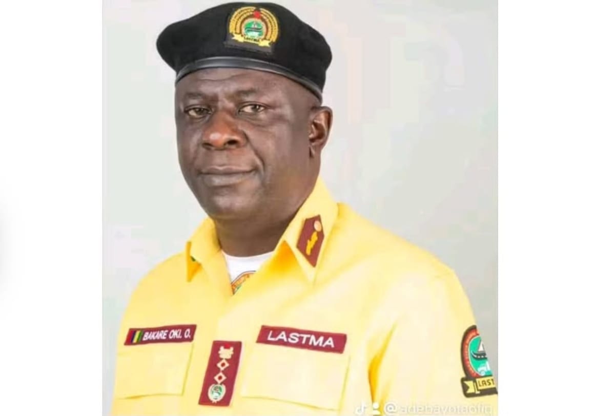 Lagos traffic officer assisting motorist on busy city street during daytime