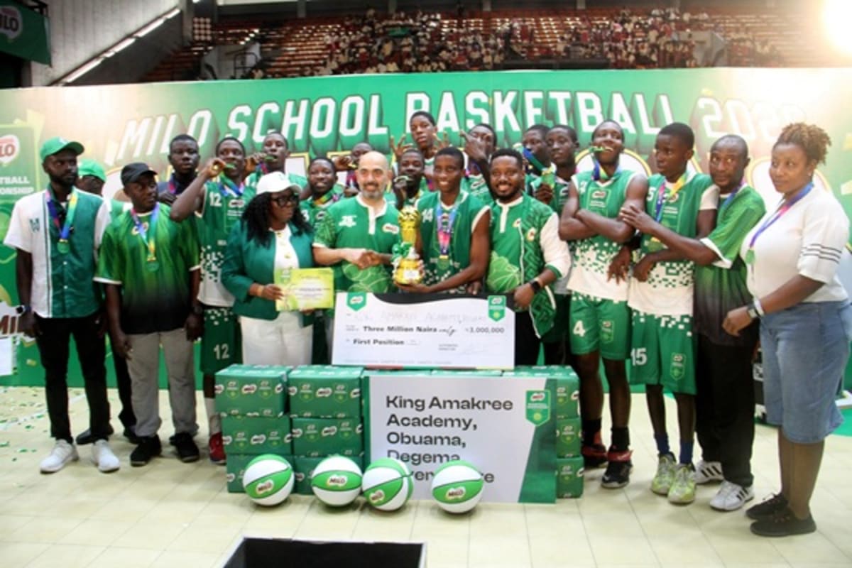 Nigerian high school basketball player Destiny Nwachi celebrating championship victory with teammates on court