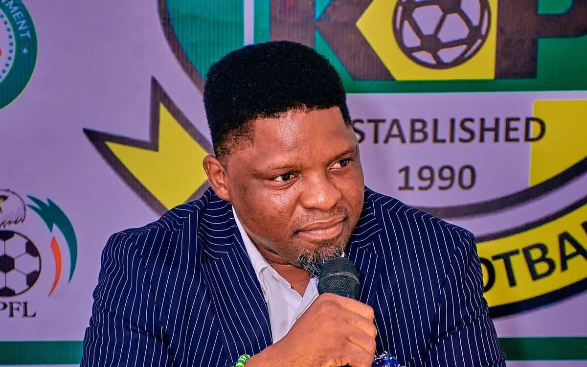 Daniel Ogunmodede speaking at podium during official unveiling ceremony at Kano Pillars Football Club