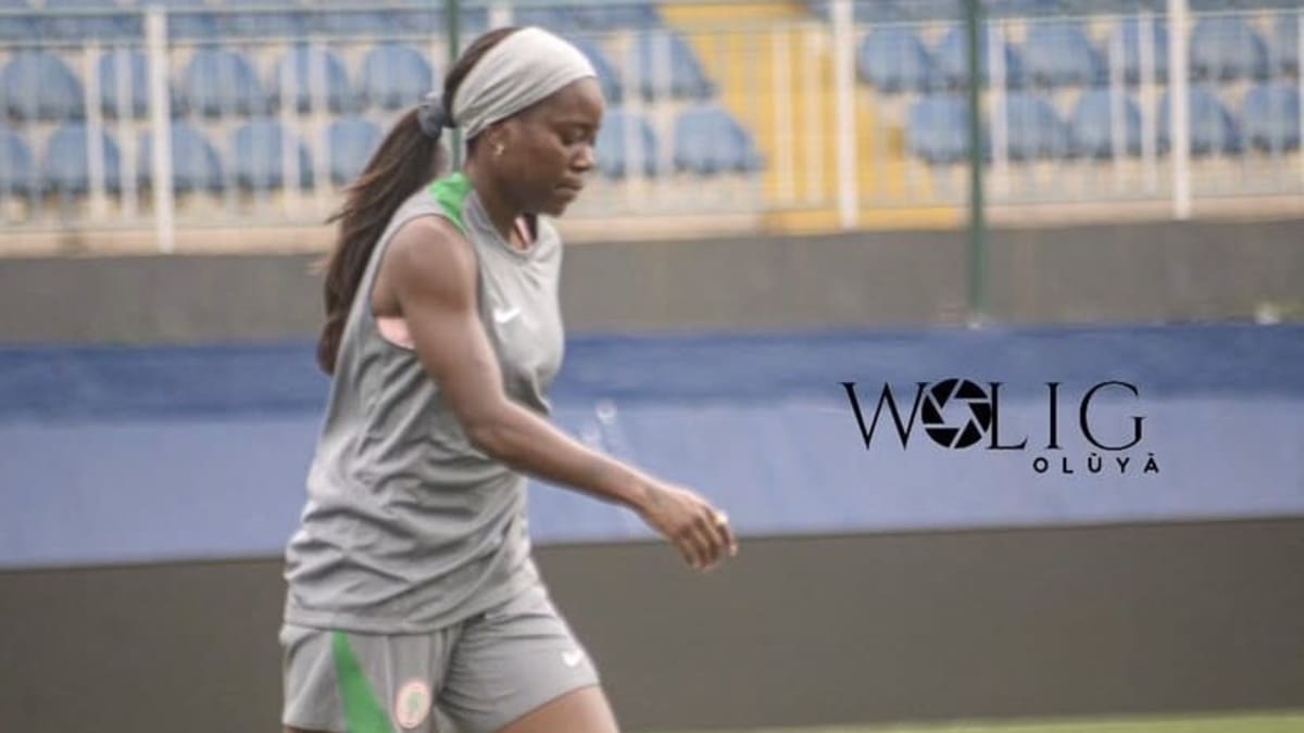Toni Payne in Nigeria Super Falcons jersey celebrating with teammates during championship victory