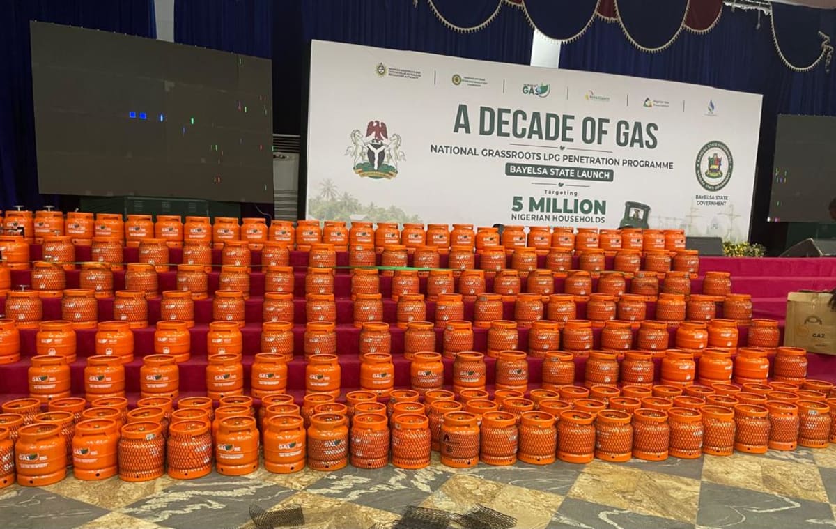 Nigerian family cooking safely with clean liquefied petroleum gas in their home kitchen