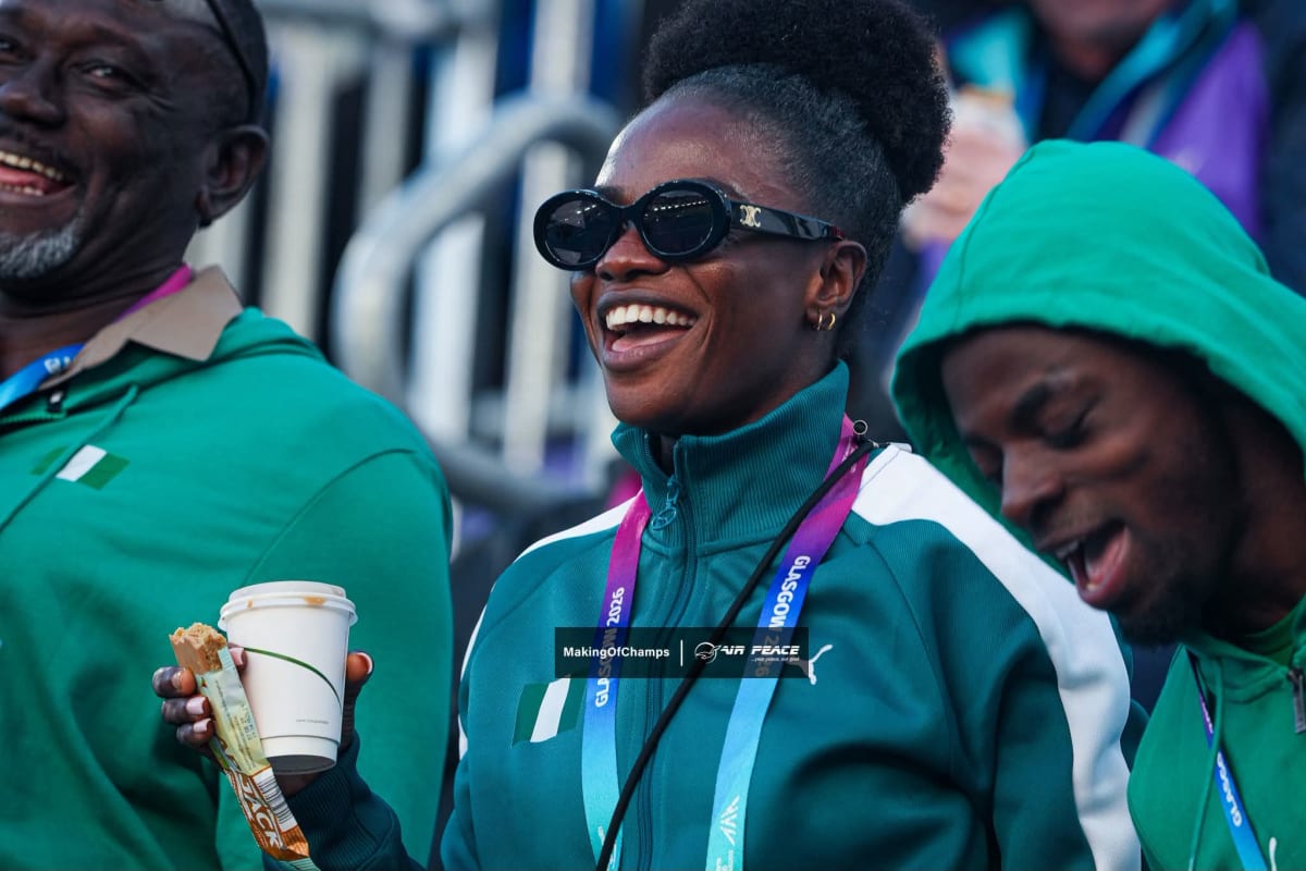 Tobi Amusan standing on Commonwealth Games podium receiving bronze medal in Glasgow