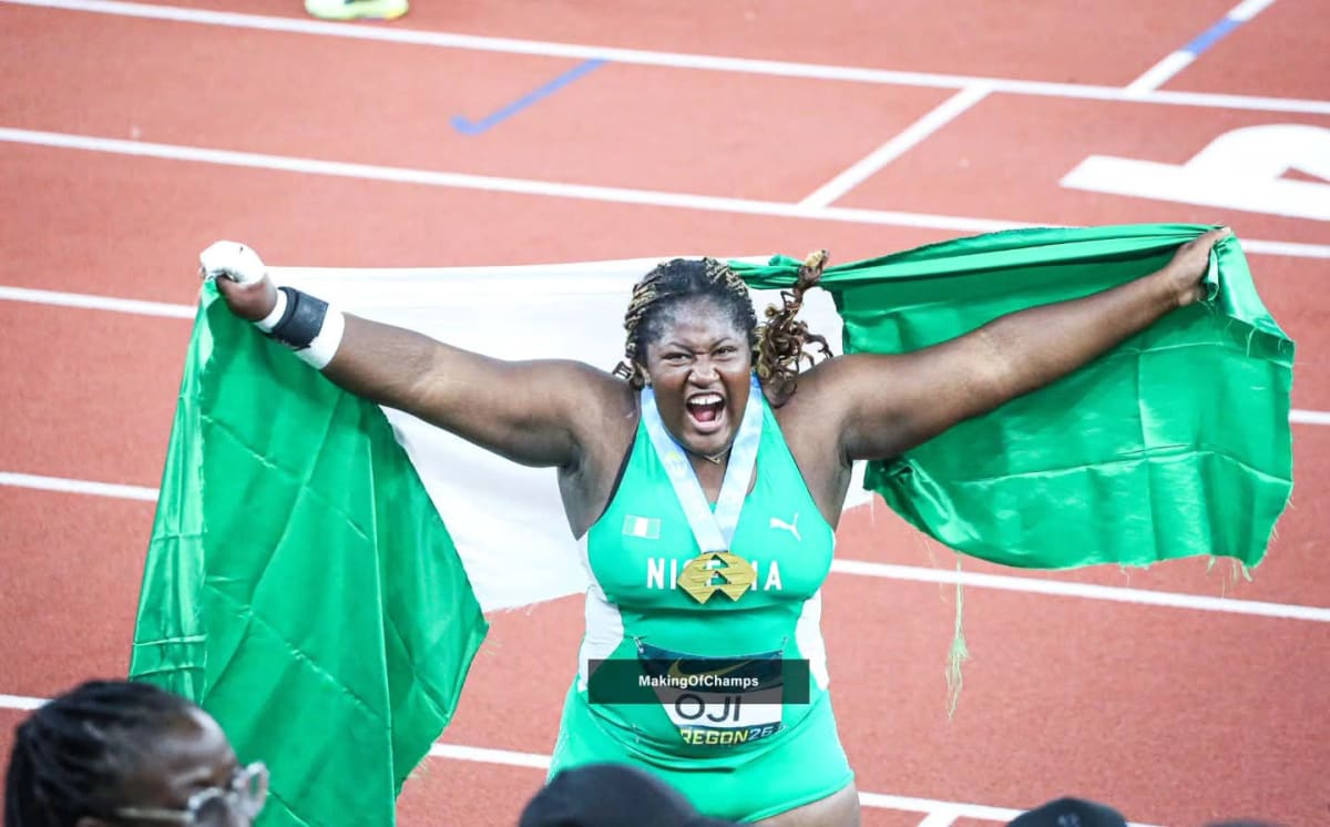Jessica Oji celebrating with Nigerian flag after winning shot put gold medal in Oregon