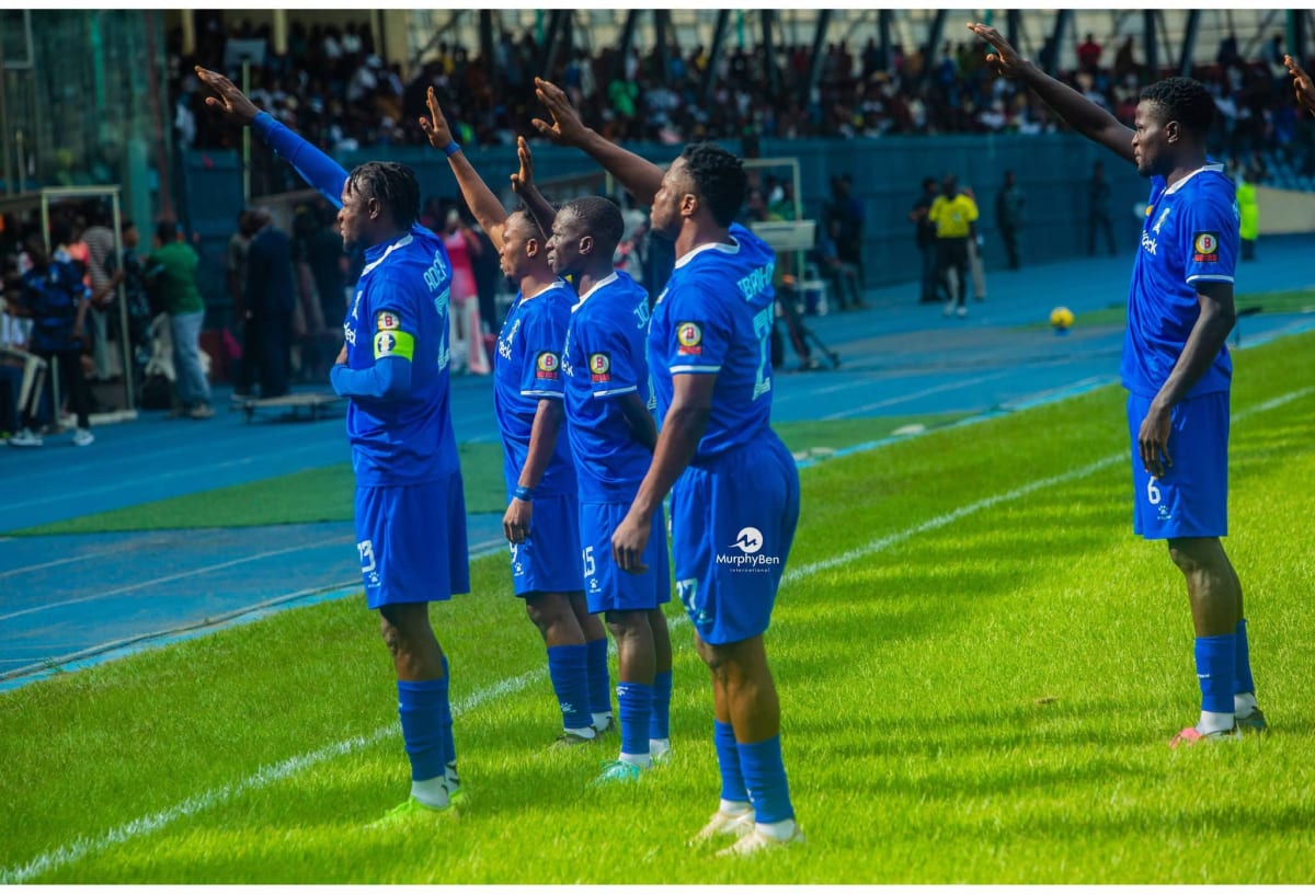 Nigerian football players celebrating on field during Premier League season opener match