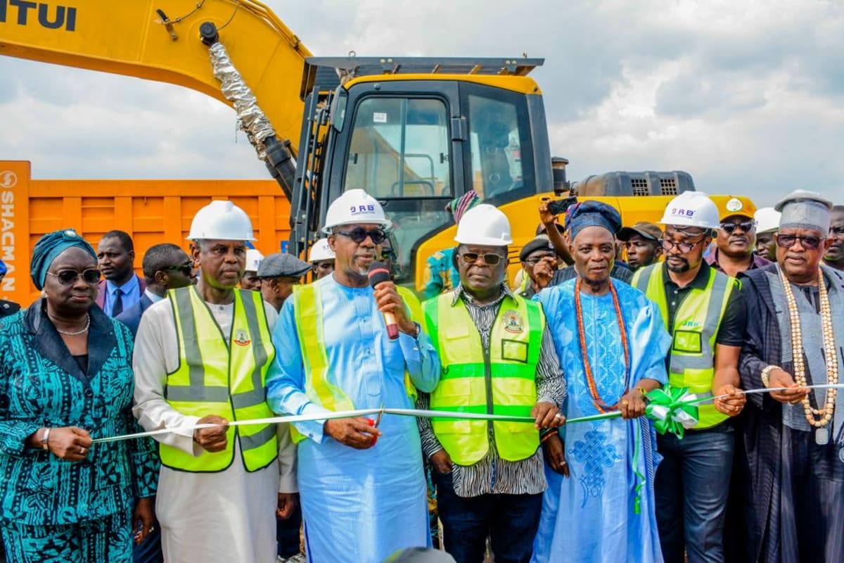 Construction workers beginning road reconstruction project on Nigerian highway connecting major cities