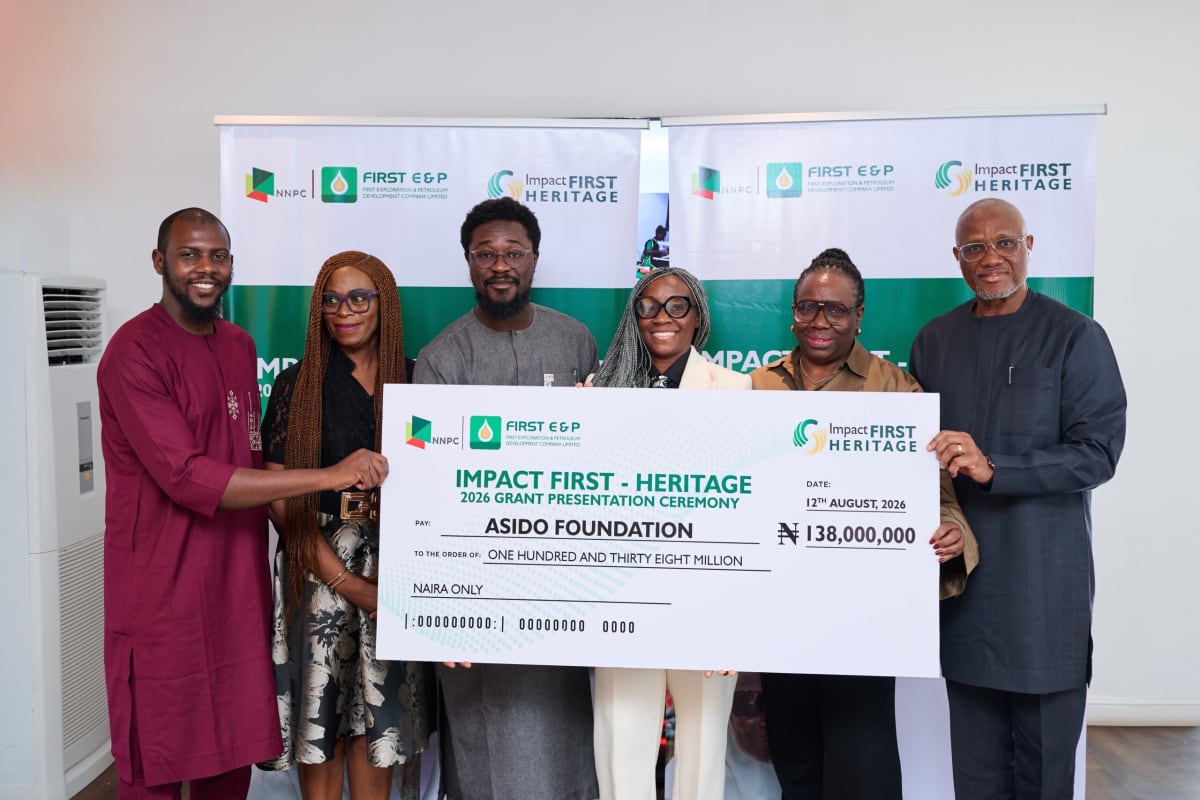 Nigerian healthcare workers and community leaders celebrating multi-year nonprofit funding announcement in Lagos