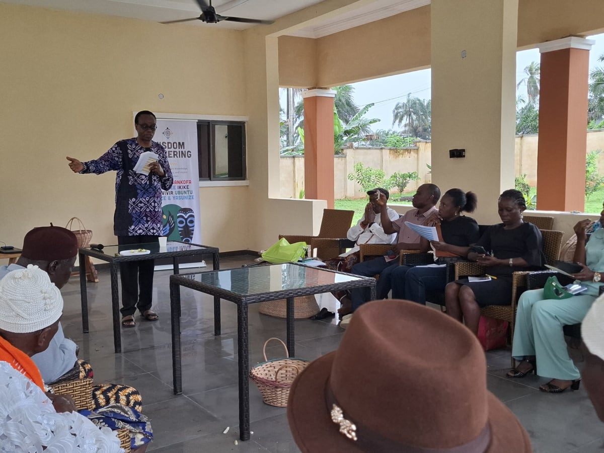 Community members gathering at ecological center in Nigeria to discuss traditional environmental wisdom