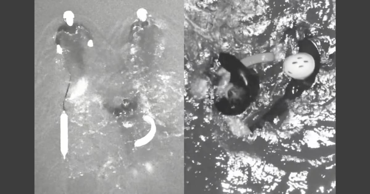 ** Rescue team using infrared drone to locate surfer at night in ocean waters