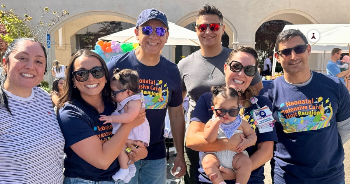 ** Toddlers and families celebrate with NICU nurses and doctors at hospital reunion event