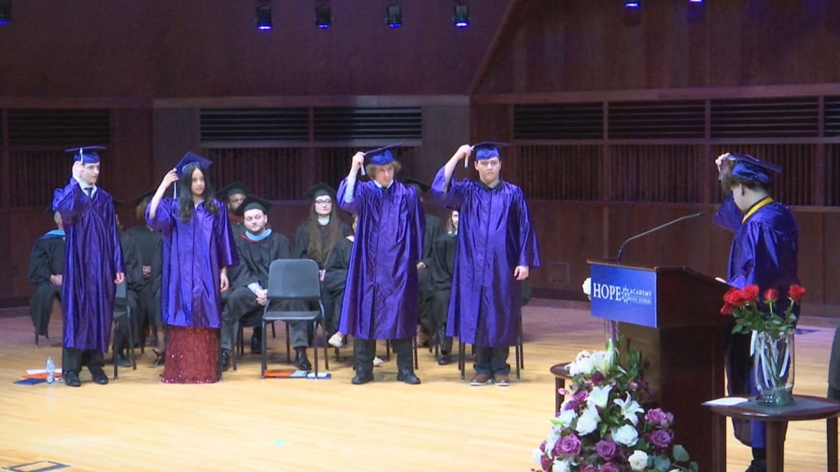 Hope Academy graduates in caps and gowns celebrating at Indianapolis ceremony