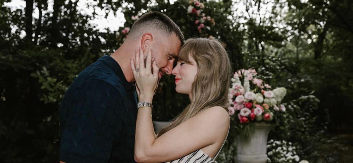 Taylor Swift and Travis Kelce smiling together at public event before their charitable wedding donations