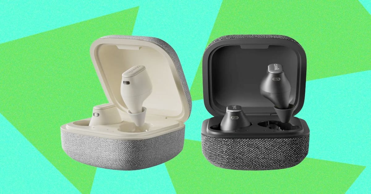 White Cearvol Wave Lite hearing aids in charging case with fabric cover on table