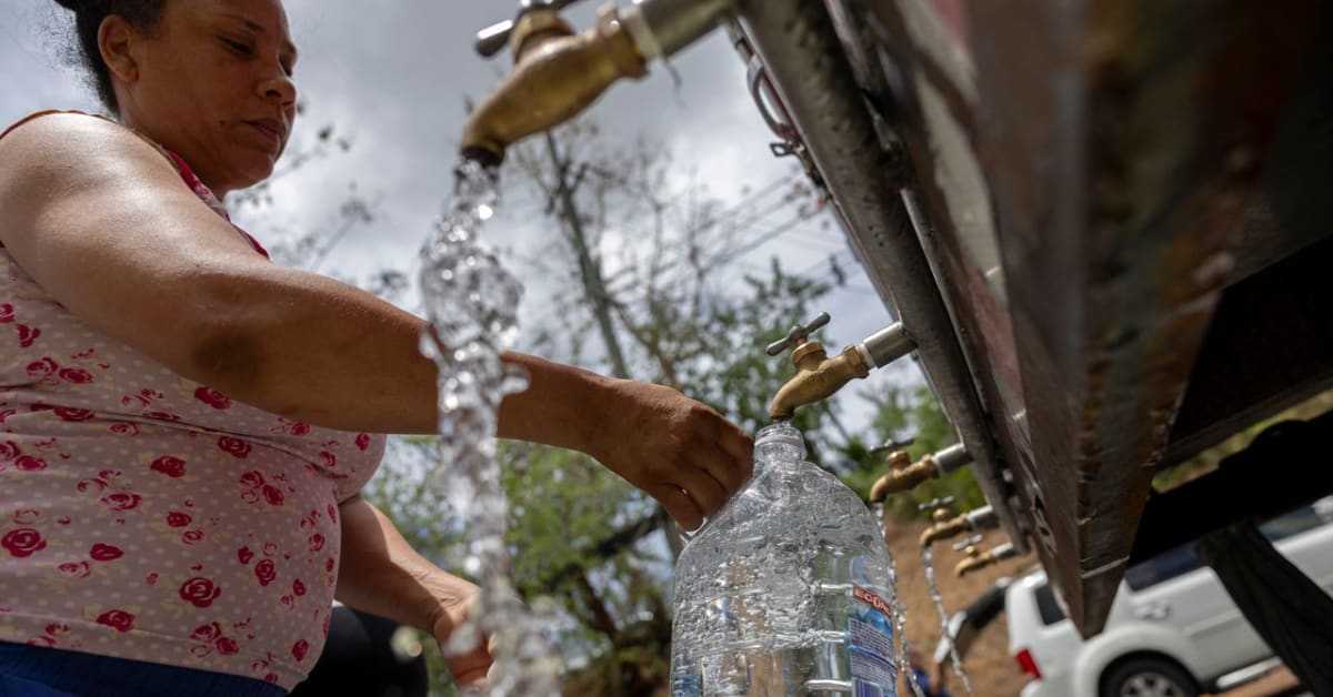 Rainwater collection system on Puerto Rican home with gutters directing water to storage tanks