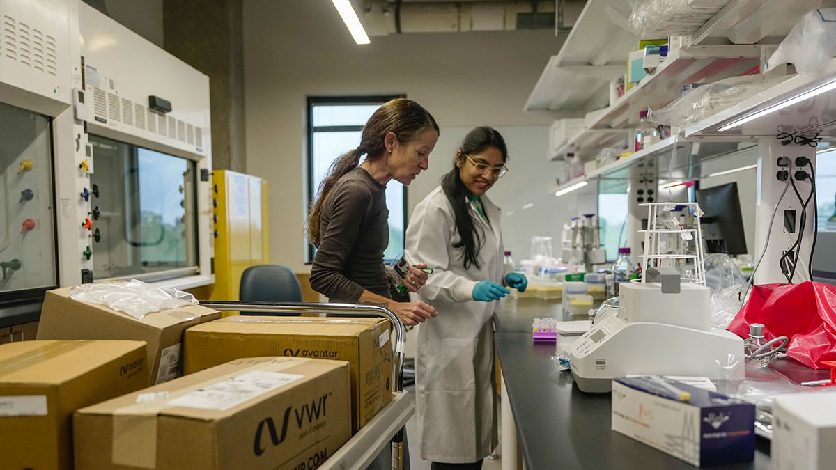 Young innovators working on breakthrough technology projects in modern collaborative workspace