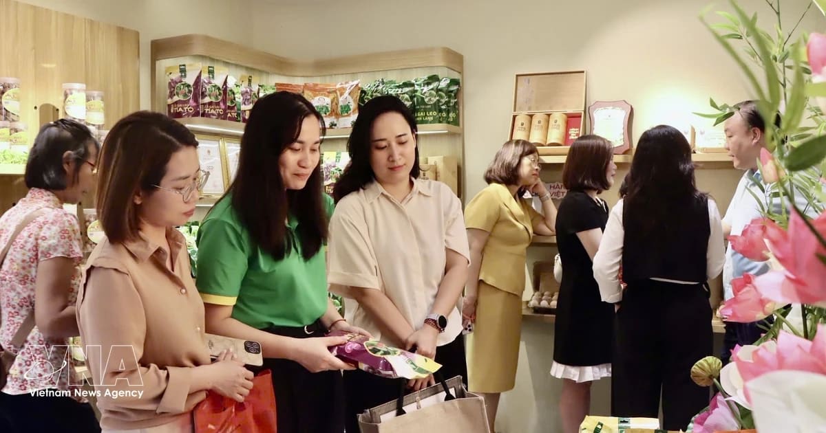 ** Vietnamese shoppers browsing products at modern supermarket in Ho Chi Minh City