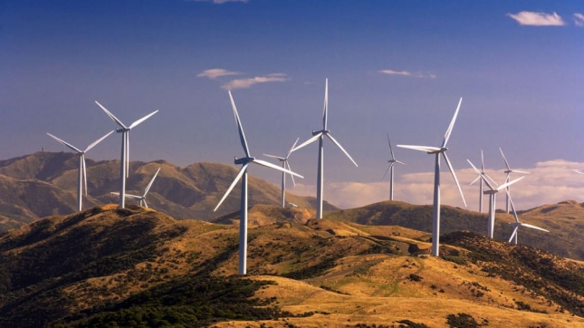 Wind turbines spinning across Mexican landscape generating renewable electricity for national grid
