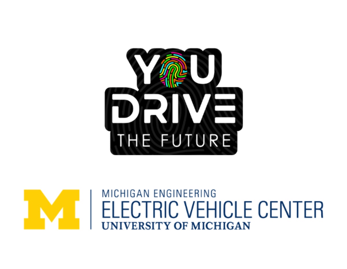 Young professional filming social media content inside modern electric vehicle manufacturing facility in Michigan