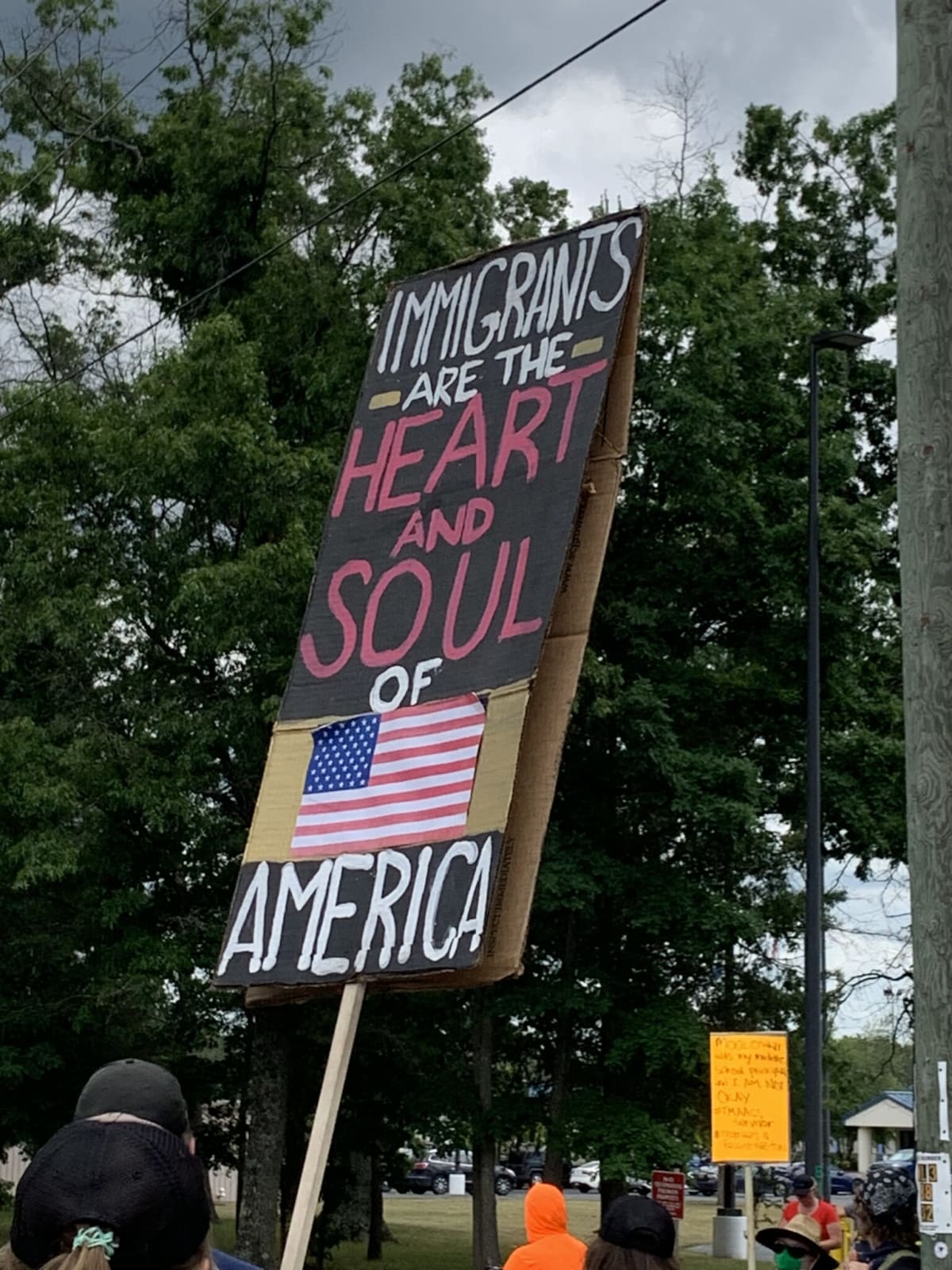 Diverse group of workers in Michigan manufacturing facility collaborating on advanced technology projects