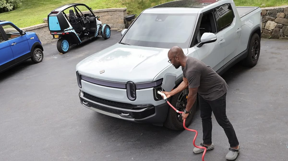 Electric vehicle charging at home station connected to residential power grid system