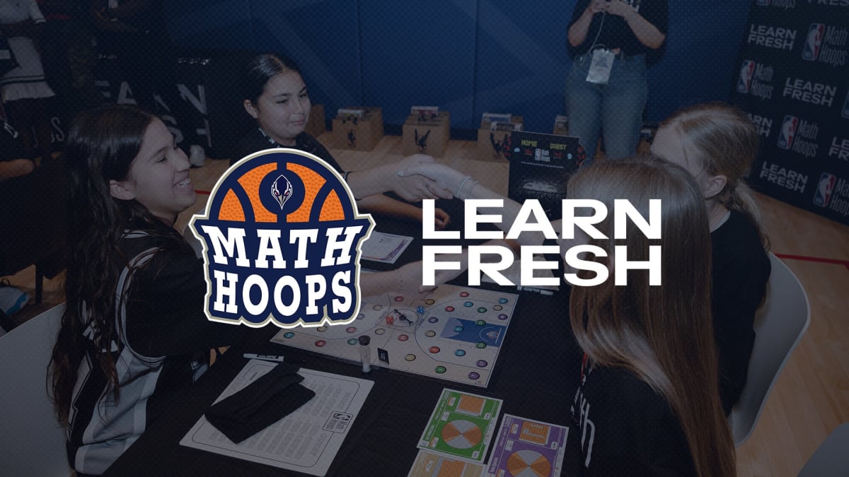Students playing NBA Math Hoops board game in classroom with Adelaide 36ers basketball materials