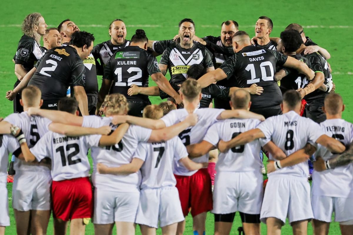 Rugby league players with physical disabilities competing on field during international tournament match