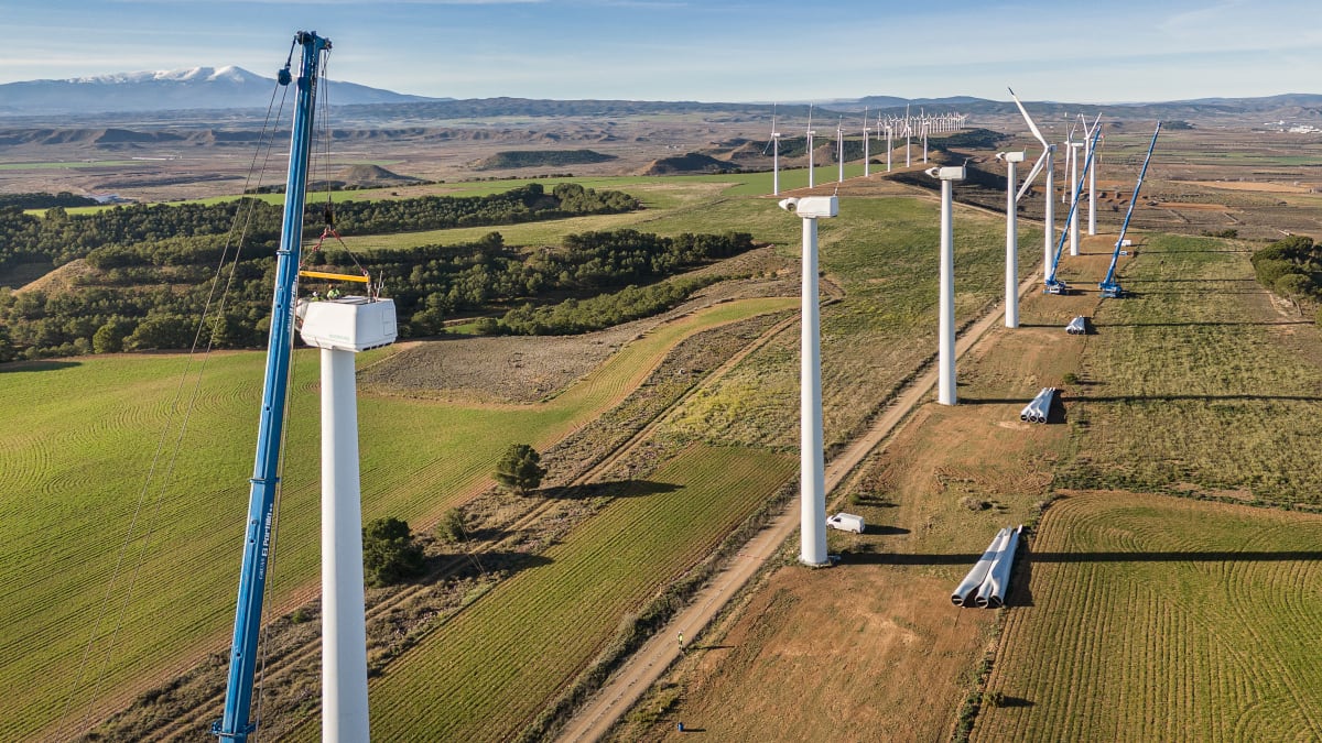 Modern wind turbines standing tall on Spanish hillside in Navarra region wind farm
