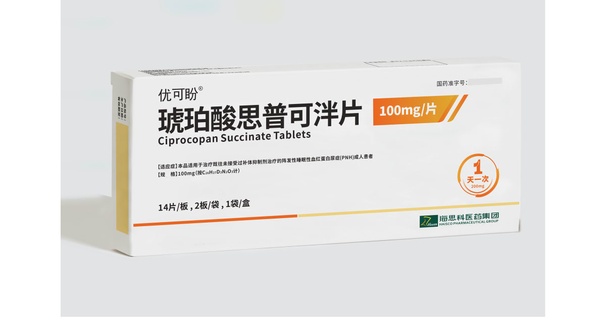 Hands holding daily medication pill bottle, representing new once-daily treatment for rare blood disease