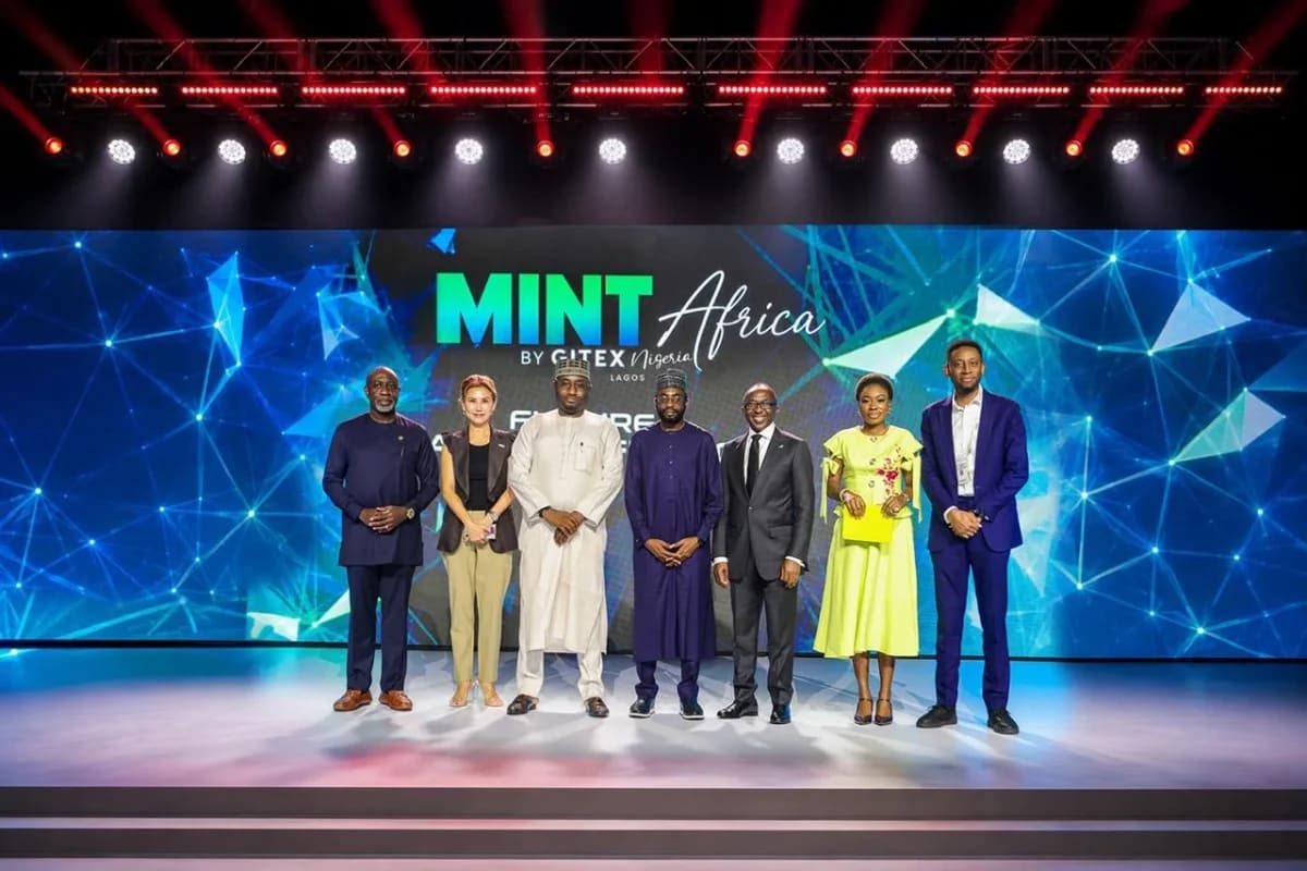 African entrepreneurs using mobile phones for digital banking and financial services in Lagos marketplace