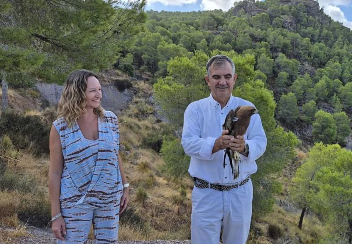 ** Wildlife rehabilitation specialist at El Valle Centre caring for recovered bird before release into nature