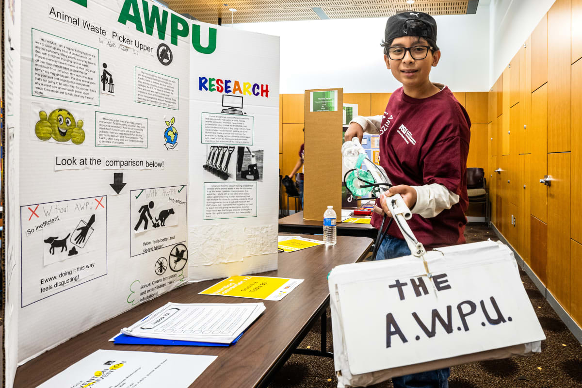 Fifth grader Margaret Brown displays Cat Company Cat Toys invention at Arizona competition