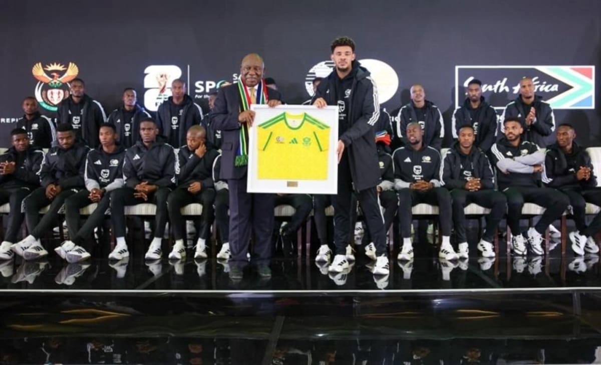 South Africa's Bafana Bafana national soccer team celebrating together in their yellow and green jerseys