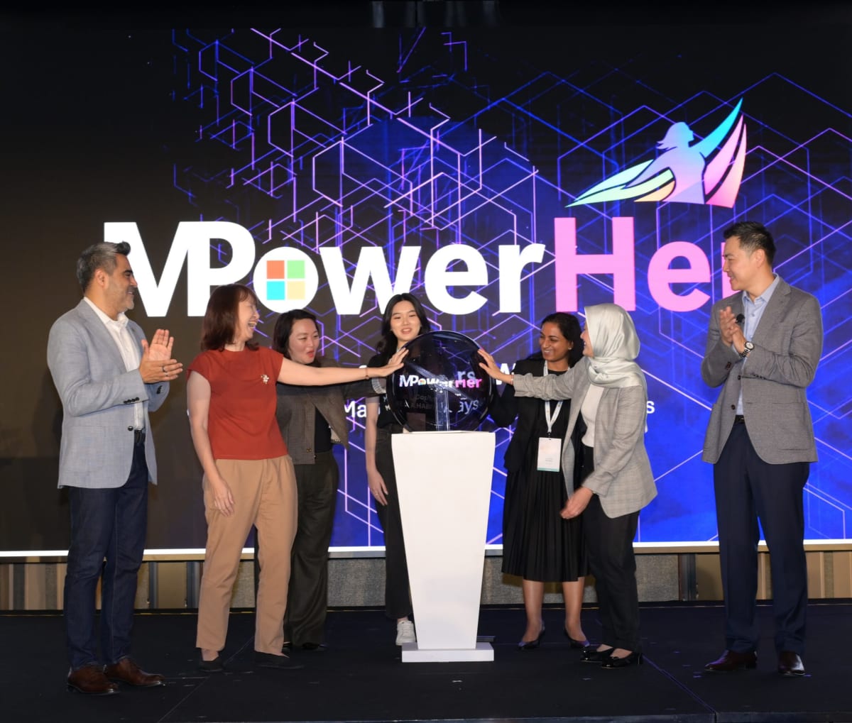 Seven people standing together at Microsoft Singapore MPowerHer program launch event
