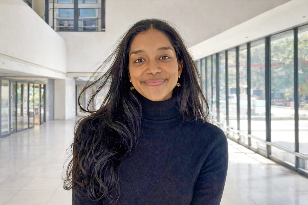 MIT student Srihitha Dasari stands with co-founders in rural Argentina hospital setting